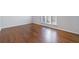 Bright living room featuring hardwood floors and a large window at 13 Ivy Ne Sq, Atlanta, GA 30342