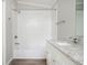 This bathroom offers a tub shower with subway tile backsplash and a dual sink vanity with updated cabinets at 3162 Alston Drive Dr, Decatur, GA 30032