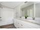This bathroom offers a dual sink vanity with updated cabinets and fixtures with a tub shower at 3162 Alston Drive Dr, Decatur, GA 30032