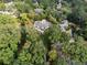 An aerial view of a stately home with mature trees at 4395 Woodland Brook Se Dr, Atlanta, GA 30339