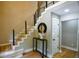 Spacious foyer has hardwood floors, a staircase with black metal accents, and modern décor at 4395 Woodland Brook Se Dr, Atlanta, GA 30339