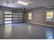 Spacious garage with a modern door design and natural light from windows at 4395 Woodland Brook Se Dr, Atlanta, GA 30339