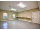 Large garage featuring built-in shelving for organized storage and natural light from two windows at 4395 Woodland Brook Se Dr, Atlanta, GA 30339