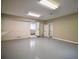Spacious garage with access to the house and side yard, featuring a durable gray floor at 4395 Woodland Brook Se Dr, Atlanta, GA 30339