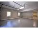 Large garage with ample space and natural light from two windows at 4395 Woodland Brook Se Dr, Atlanta, GA 30339