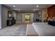 Spacious main bedroom with ensuite bathroom, wood accent wall and plush carpet at 4395 Woodland Brook Se Dr, Atlanta, GA 30339