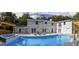 A sparkling pool, hot tub, and brick home make an entertainer's dream backyard at 4395 Woodland Brook Se Dr, Atlanta, GA 30339