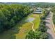 Aerial view of basketball and tennis courts surrounded by green spaces in the community at 510 Winder Trl, Canton, GA 30114