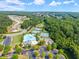 This aerial view highlights community amenities including tennis courts, a pool, and parking at 510 Winder Trl, Canton, GA 30114