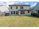 A level backyard with a grass lawn and mature trees offers privacy and space for recreation at 510 Winder Trl, Canton, GA 30114