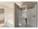 Bathroom with stand up shower, and a jacuzzi tub with tile surround at 510 Winder Trl, Canton, GA 30114