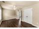Bedroom with ceiling fan, hardwood floors, and double door closet at 510 Winder Trl, Canton, GA 30114