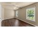 Bedroom with hardwood floors, ceiling fan, and natural light at 510 Winder Trl, Canton, GA 30114