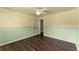 This bedroom features a ceiling fan, window, and hardwood floors at 510 Winder Trl, Canton, GA 30114