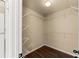 This spacious walk-in closet features wood floors, white wire shelving, and ample storage space at 510 Winder Trl, Canton, GA 30114