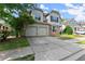The home has a two-car garage, stone accents, a manicured lawn, and mature landscaping at 510 Winder Trl, Canton, GA 30114