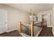 Upstairs hallway with wood floors and natural light at 510 Winder Trl, Canton, GA 30114