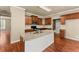 Modern kitchen with granite countertops, stainless steel appliances, and dark wood cabinets at 510 Winder Trl, Canton, GA 30114