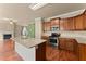 Kitchen with granite countertops, stainless steel appliances, and island at 510 Winder Trl, Canton, GA 30114