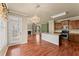 Open-concept kitchen and dining area with granite countertops, stainless steel appliances, and hardwood floors at 510 Winder Trl, Canton, GA 30114