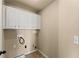 Laundry room with upper cabinets and utility sink at 510 Winder Trl, Canton, GA 30114