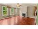 Inviting living room with hardwood floors, a fireplace, and large windows with great natural light at 510 Winder Trl, Canton, GA 30114