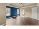 Main bedroom with hardwood floors, windows, and a view of the backyard at 510 Winder Trl, Canton, GA 30114