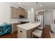 Modern kitchen featuring stainless steel appliances, quartz countertops, and bar seating at 61 N Auburn Landing Pl, Auburn, GA 30011