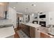 Spacious kitchen with an island, stainless steel appliances, and open-concept living area at 61 N Auburn Landing Pl, Auburn, GA 30011