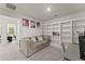 Spacious living room features a built-in bookshelf, workstation, and comfortable seating area at 61 N Auburn Landing Pl, Auburn, GA 30011