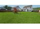 Spacious, fenced backyard with a wooden playset and lush green grass at 701 Woodward Ct, Canton, GA 30114