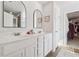 Elegant bathroom featuring double sinks, quartz countertop, and modern fixtures at 701 Woodward Ct, Canton, GA 30114