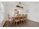 Formal dining room with a decorative light fixture and seating for eight at 701 Woodward Ct, Canton, GA 30114