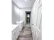 Bathroom featuring double vanities with modern fixtures and a separate toilet room at 102 Neal Ave, Stockbridge, GA 30281