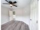 Bright bedroom featuring gray flooring, a ceiling fan, and freshly painted neutral walls at 102 Neal Ave, Stockbridge, GA 30281