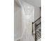 Bright hallway features clean design with recessed lighting and a staircase with dark metal railing at 102 Neal Ave, Stockbridge, GA 30281
