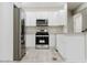 Modern kitchen features stainless steel appliances, stylish countertops, and updated cabinets at 102 Neal Ave, Stockbridge, GA 30281