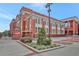 Historic brick building featuring beautiful architectural details and lush landscaping, offering a unique cultural experience at 1125 Lewis Ridge Cir, Lawrenceville, GA 30045