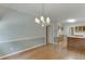 Dining room with hardwood floors and view to the kitchen at 1125 Lewis Ridge Cir, Lawrenceville, GA 30045