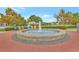 Relaxing community fountain with colorful chairs, surrounded by manicured landscaping at 1125 Lewis Ridge Cir, Lawrenceville, GA 30045