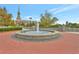 Community fountain with brick surroundings, offering a peaceful gathering spot at 1125 Lewis Ridge Cir, Lawrenceville, GA 30045