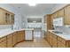 Spacious kitchen featuring wooden cabinets, white countertops, and a full range of appliances at 1125 Lewis Ridge Cir, Lawrenceville, GA 30045