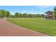 Expansive community lawn perfect for events, featuring a paved walkway and gathering spaces at 1125 Lewis Ridge Cir, Lawrenceville, GA 30045