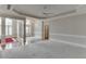 Bright living room featuring plush carpet, chandelier, and coffered ceiling at 1125 Lewis Ridge Cir, Lawrenceville, GA 30045