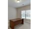 Bright office with a large window providing natural light and a built-in desk at 1125 Lewis Ridge Cir, Lawrenceville, GA 30045