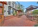 Elegant restaurant exterior featuring outdoor dining area, lush plants, and inviting entryway at 1125 Lewis Ridge Cir, Lawrenceville, GA 30045
