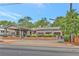 Charming brick restaurant building with outdoor patio seating area, a well-maintained landscape, and inviting curb appeal at 1125 Lewis Ridge Cir, Lawrenceville, GA 30045