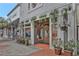 Elegant storefront adorned with potted plants, hanging floral arrangements, and a stylish entrance at 1125 Lewis Ridge Cir, Lawrenceville, GA 30045