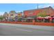 Street view showcasing local businesses, outdoor dining, and bustling community atmosphere at 1125 Lewis Ridge Cir, Lawrenceville, GA 30045