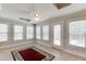 Light filled sun room with tile floors, neutral walls, and backyard views at 1125 Lewis Ridge Cir, Lawrenceville, GA 30045